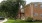 Exterior view of  brick apartment building and greenery