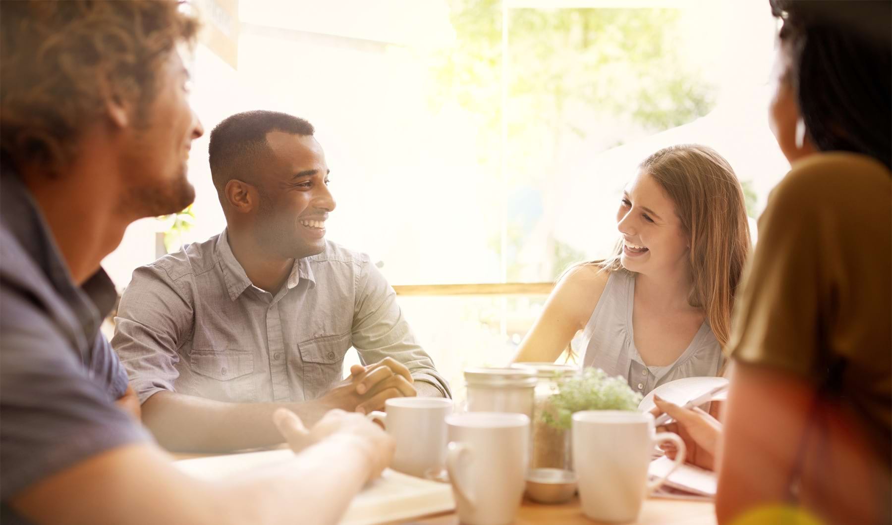 Rotator image  Family eating at a table together